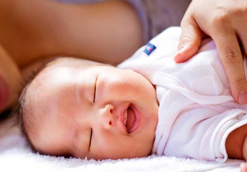 Laughing in Sleep: Babies, Newborns, What It Means, and More